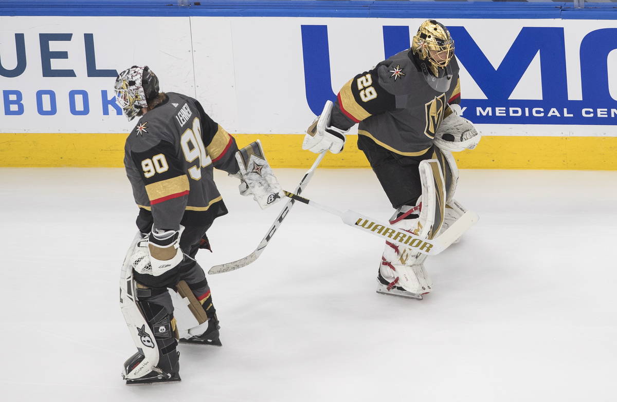 Vegas Golden Knights goalie Robin Lehner (90) and goalie Marc-Andre Fleury (29) tap sticks duri ...