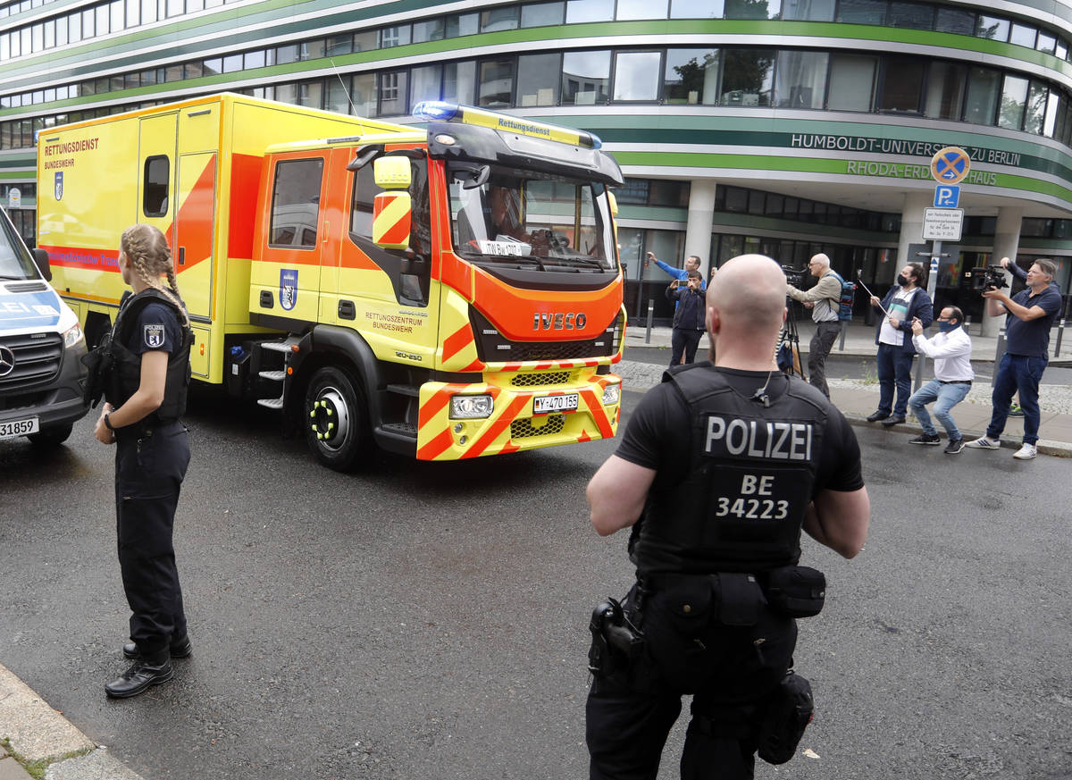 An ambulance which is believed to transport Alexei Navalny arrives at the Charite hospital in B ...