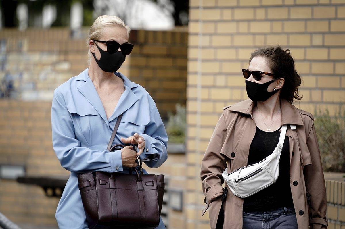 Alexei Navalny's wife Yulia, left, arrives at the Charite hospital in Berlin, Germany, Monday, ...