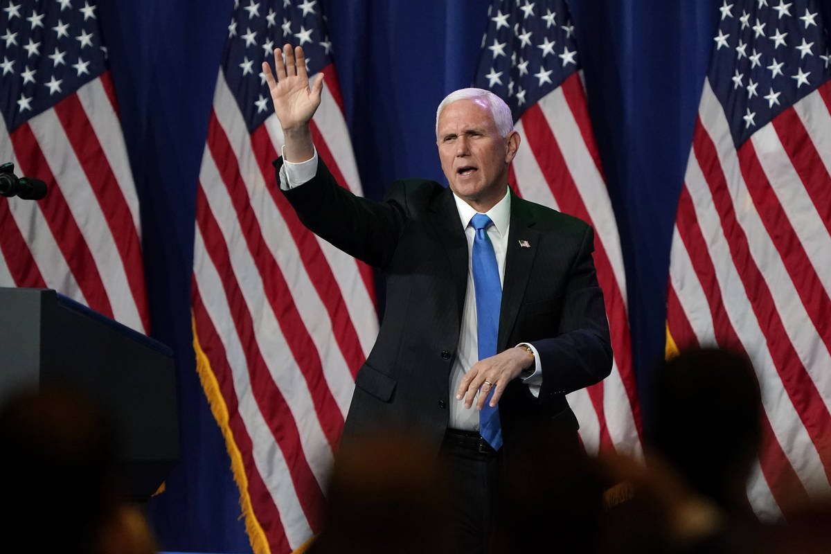 Vice President Mike Pence waves after speaking during the first day of the Republican National ...