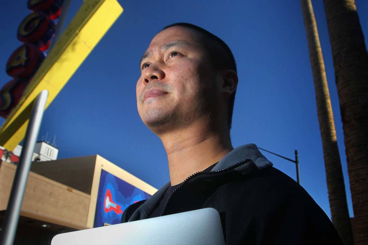 Tony Hsieh, CEO of online clothing retailer Zappos.com, stands near a Vegas neon sign in downto ...