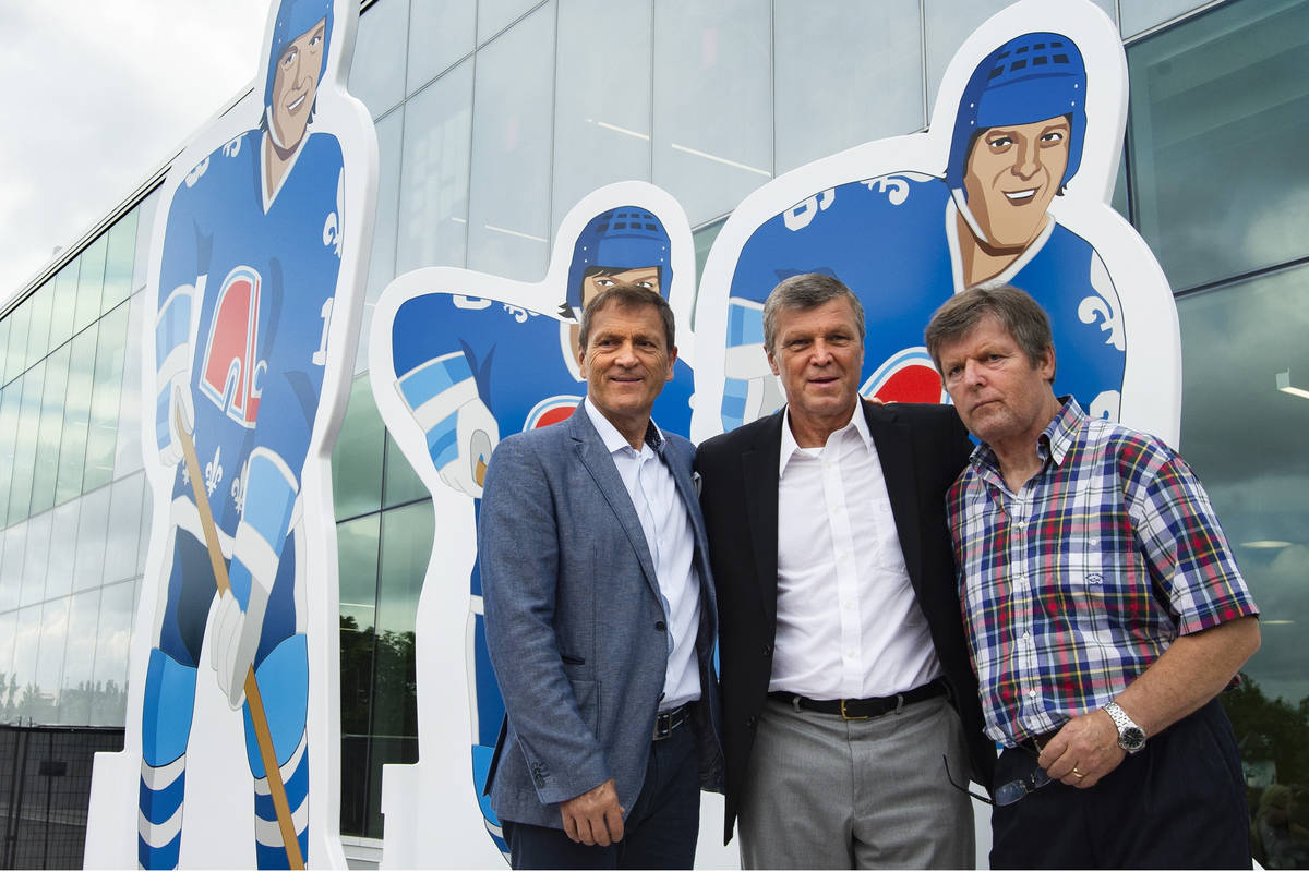 Former NHL Quebec Nordiques and brothers Anton, Peter and Marian Stastny, from left, pose durin ...