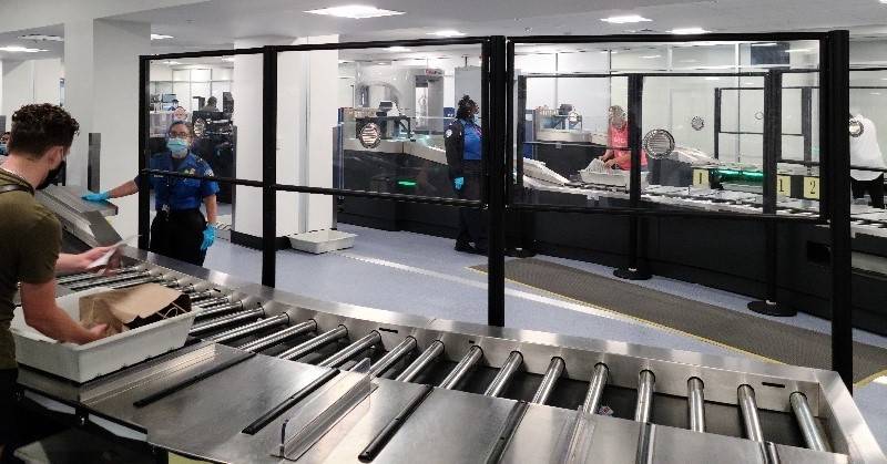 Acrylic barriers have been installed in security checkpoints at McCarran International Airport ...