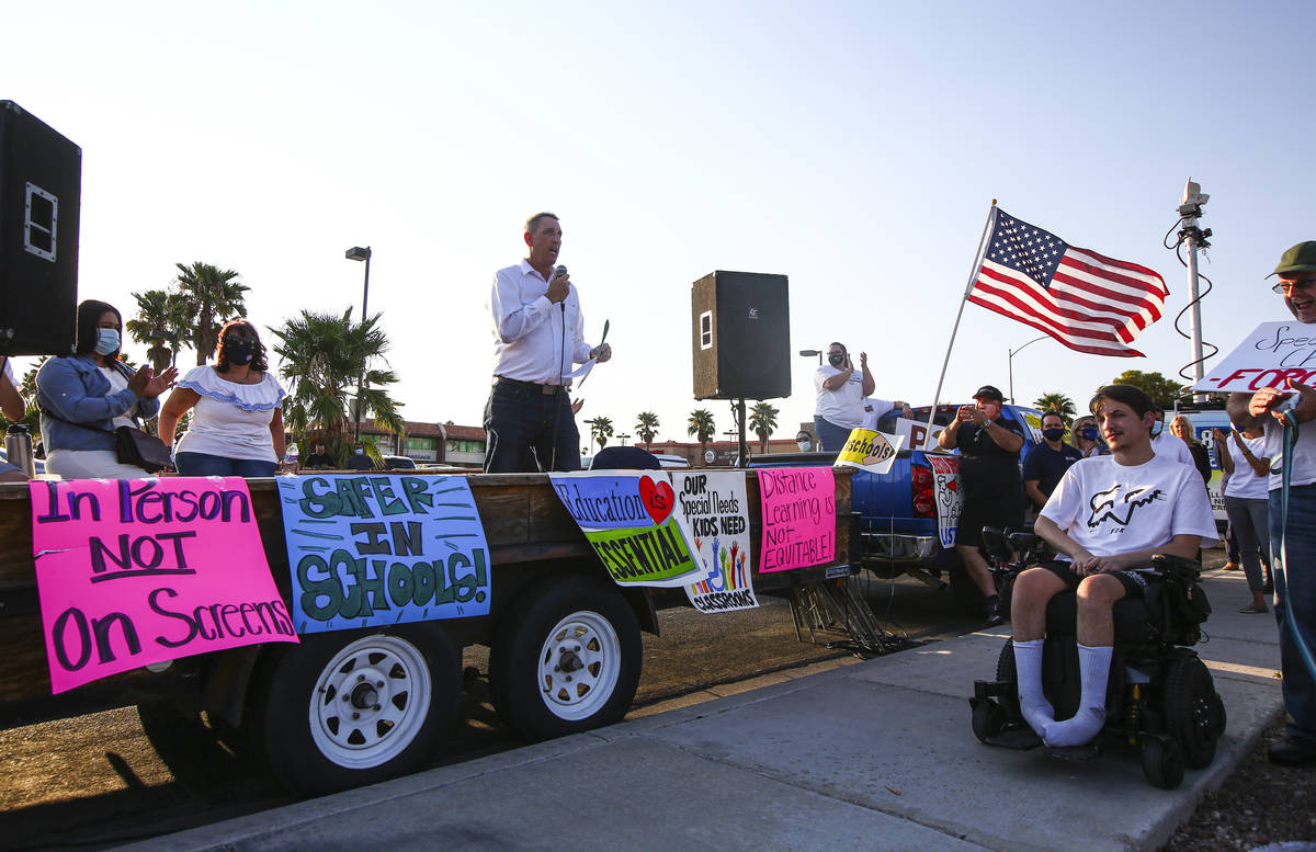 State Sen. Scott Hammond, R-Las Vegas, speaks during a demonstration in support of reopening pu ...