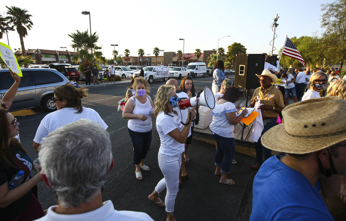 Erin Phillips, president of Power2Parent, speaks during a demonstration in support of reopening ...