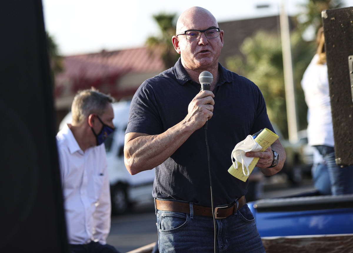 Byron Brooks, a suicide prevention advocate, speaks during a demonstration in support of reopen ...