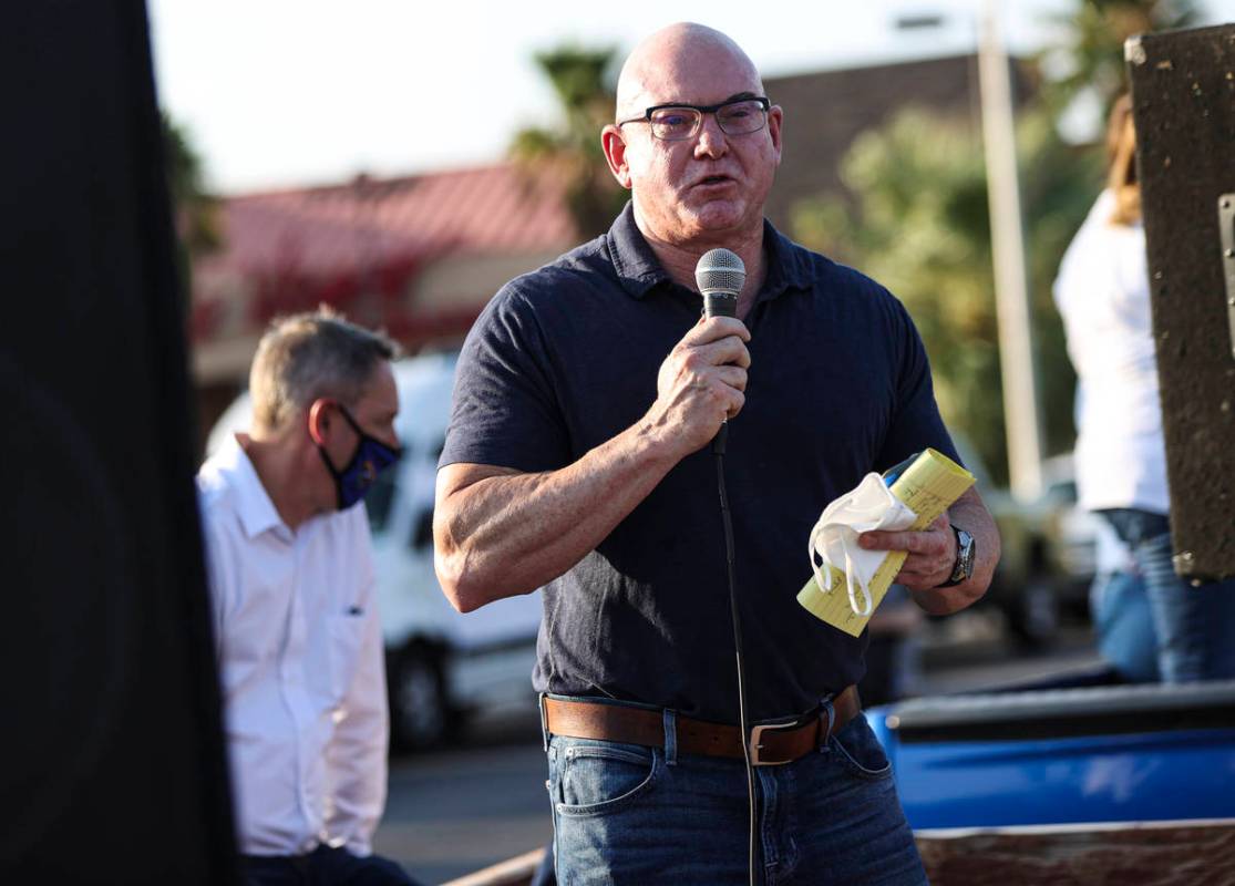 Byron Brooks, a suicide prevention advocate, speaks during a demonstration in support of reopen ...