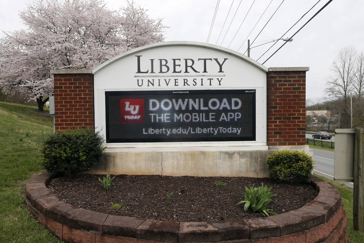 FILE - In this March 24, 2020 file photo, a sign marks the entrance to Liberty University, Tues ...