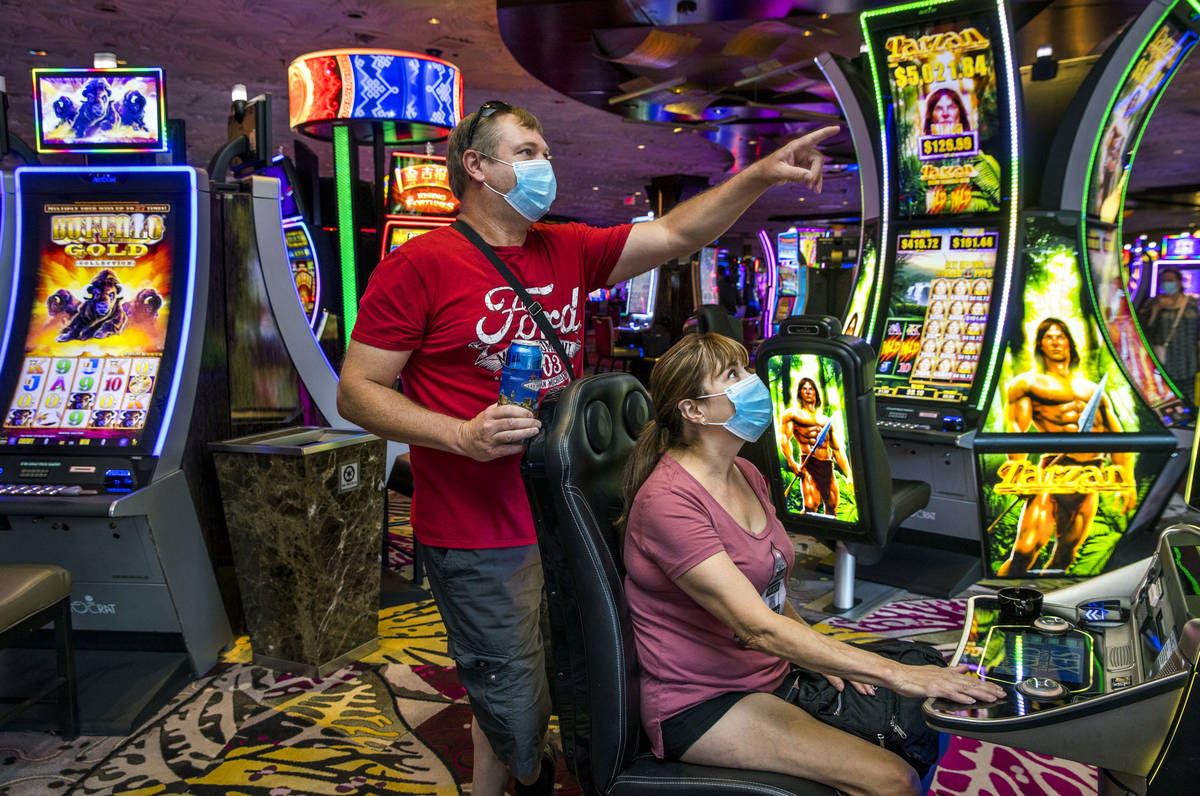 John and Julie Dumpprope from Minnesota, look to their Sex in the City slot machine as it hits ...