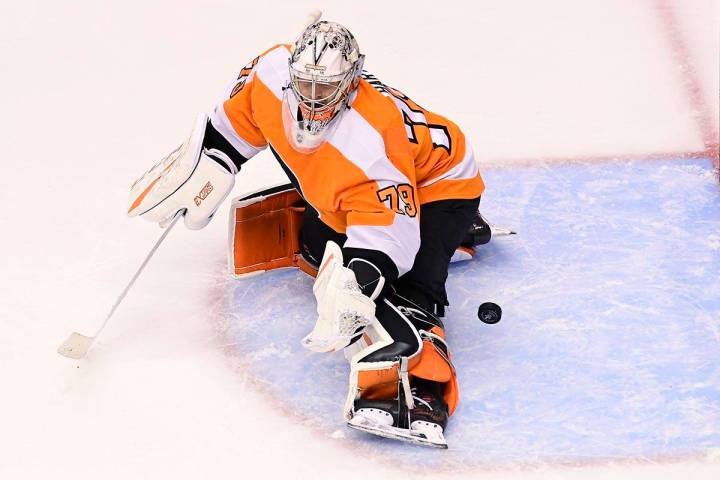Philadelphia Flyers goaltender Carter Hart (79) fails to stop the puck on a shot from New York ...