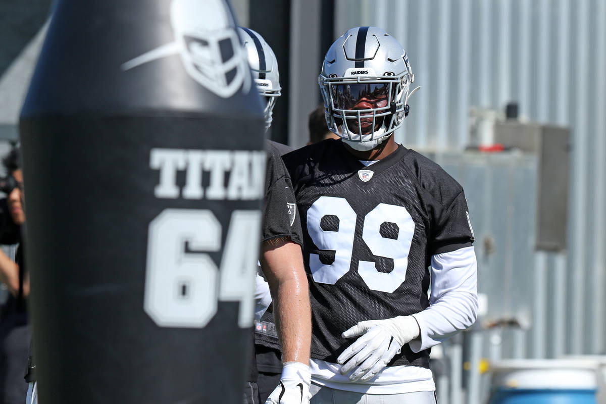 Oakland Raiders defensive end Arden Key (99) waits to hit the tackle posts during the NFL team' ...