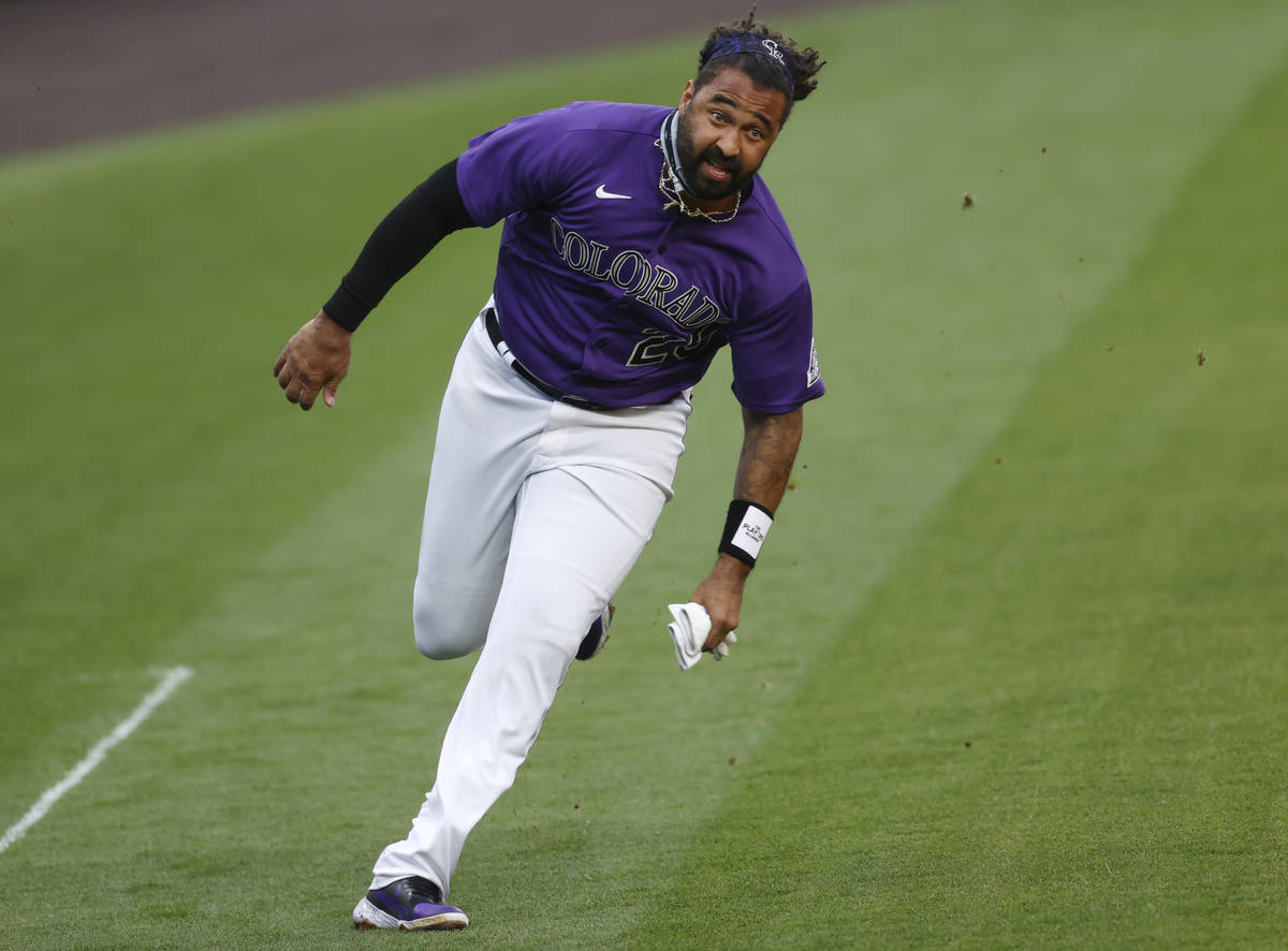 Colorado Rockies' Matt Kemp heads to home plate to score on a single hit by Raimel Tapia off Ho ...