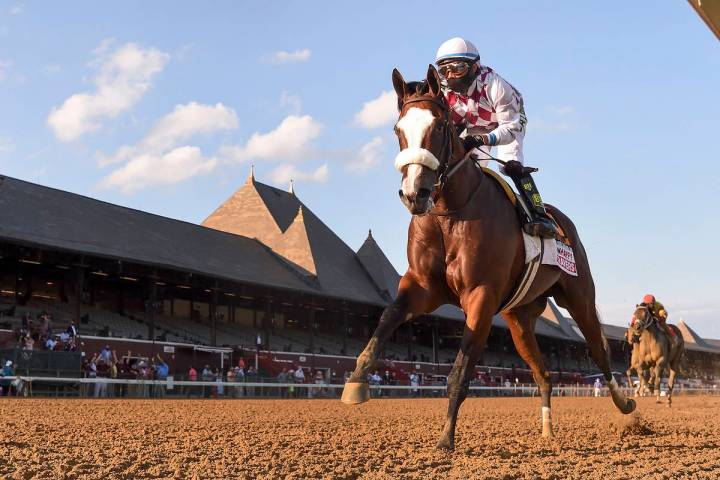 In a photo provided by the NYRA, Tiz the Law crosses the finish line to win the Travers Stakes ...