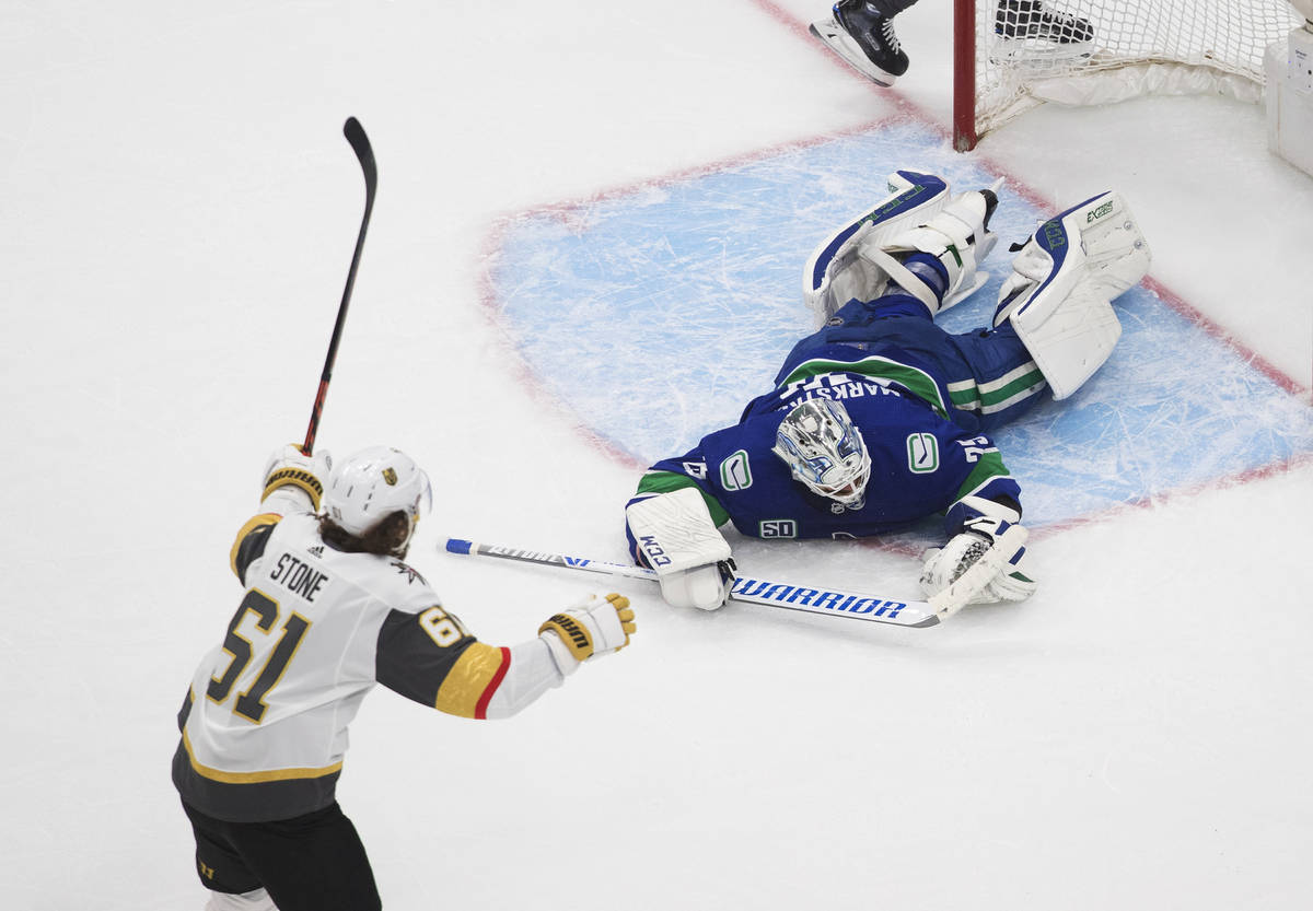 Vegas Golden Knights' Mark Stone (61) reacts as Vancouver Canucks goalie Jacob Markstrom (25) i ...