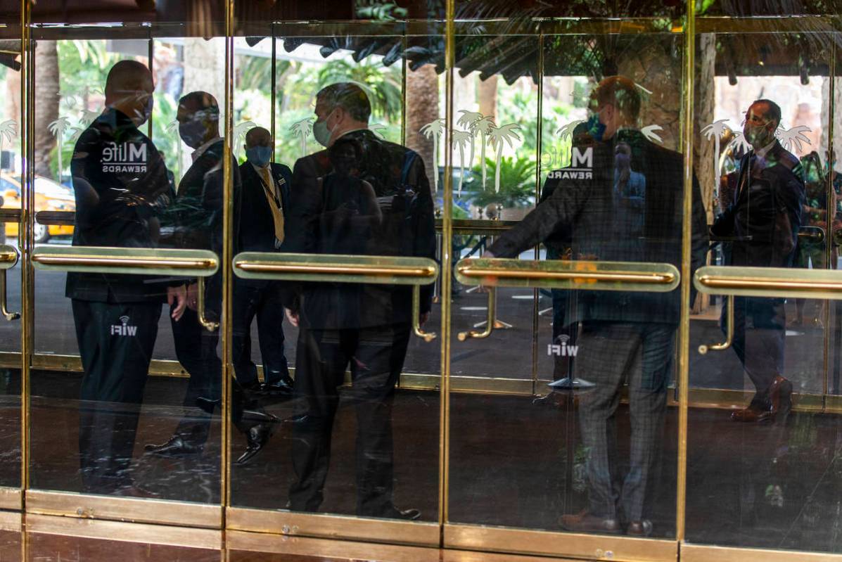 Employees ready to greet guests at the front entrance as the Mirage reopens following a COVID-1 ...