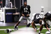 Las Vegas Raiders wide receiver Zay Jones stretches during an NFL football training camp practi ...