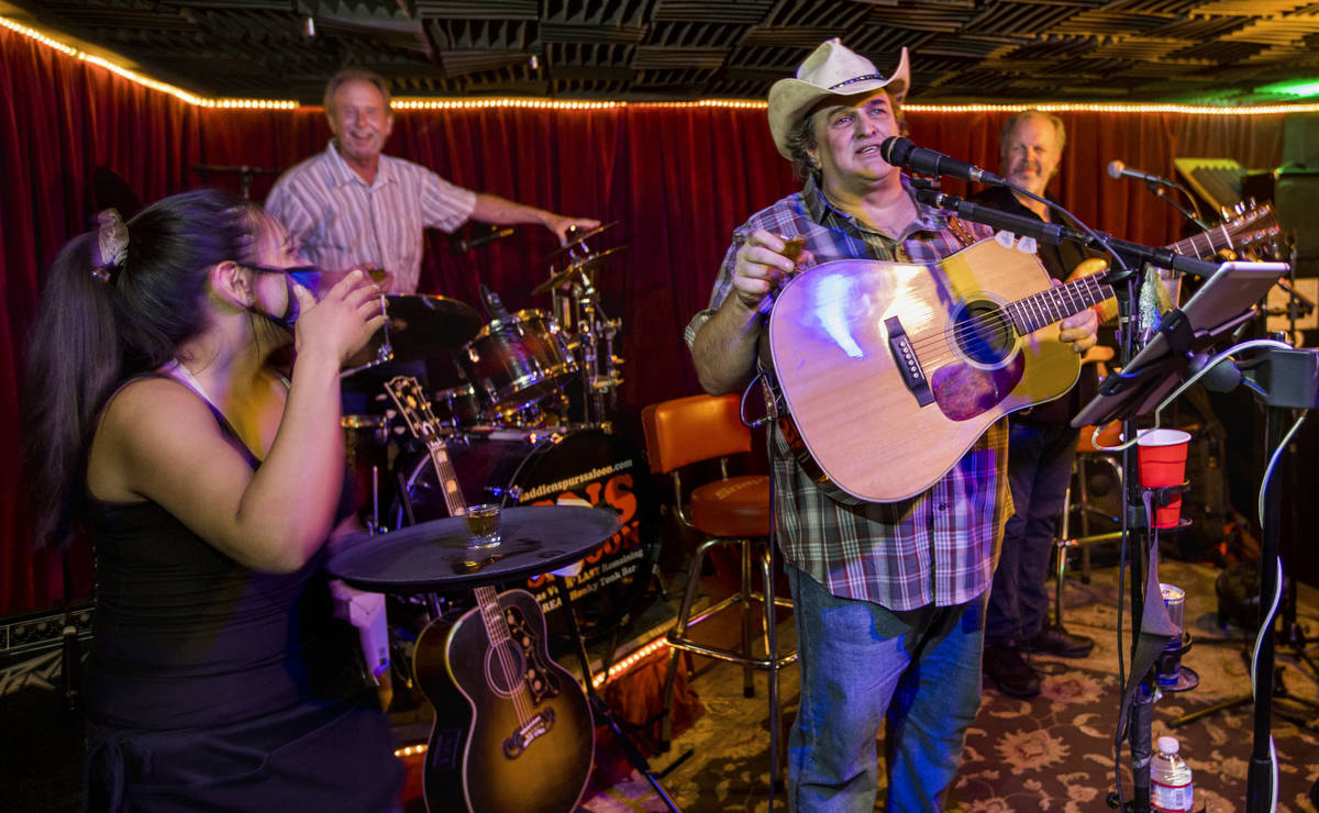 Owner Bobby Kingston, right, says a toast as he plays with his band on the final night before S ...