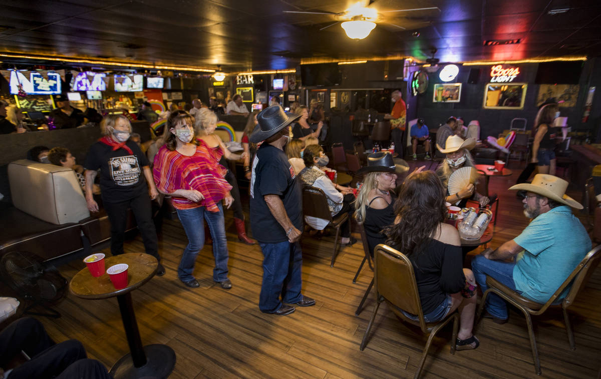 Dancers take to the floor amongst other patrons as owner Bobby Kingston plays with his band on ...