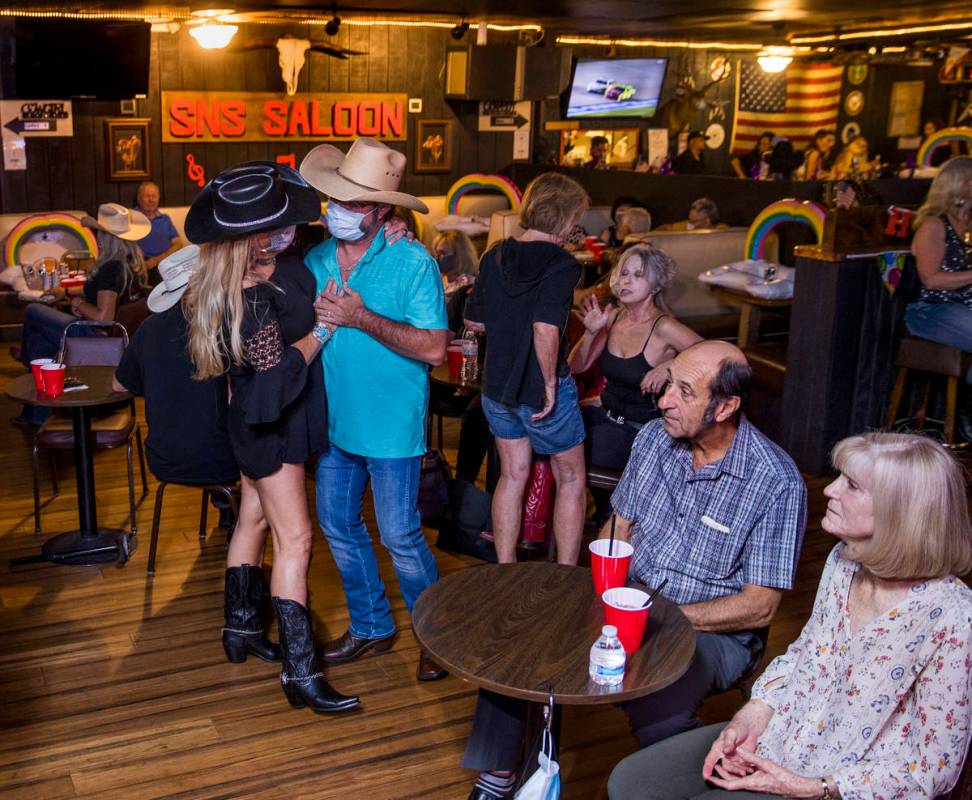 Patrons drink and take to the floor as owner Bobby Kingston plays with his band on the final ni ...