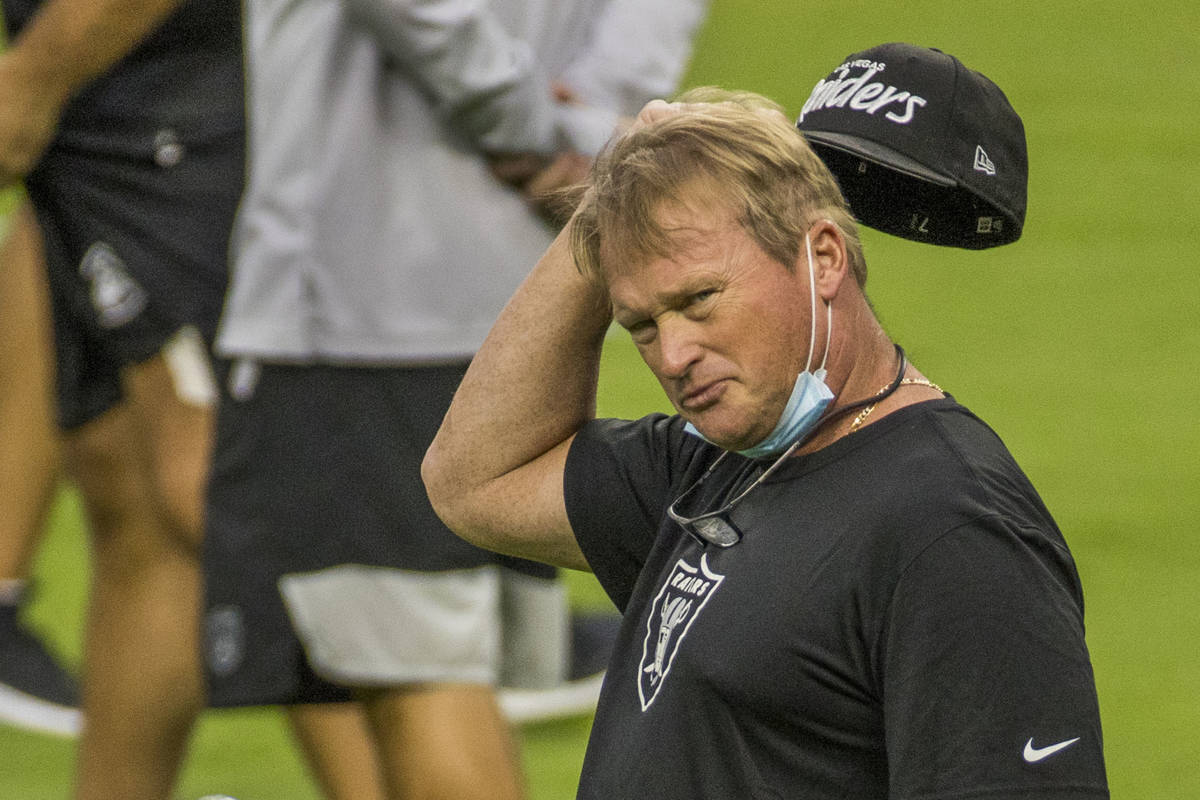 Las Vegas Raiders head coach Jon Gruden scratches his head while looking towards defensive line ...