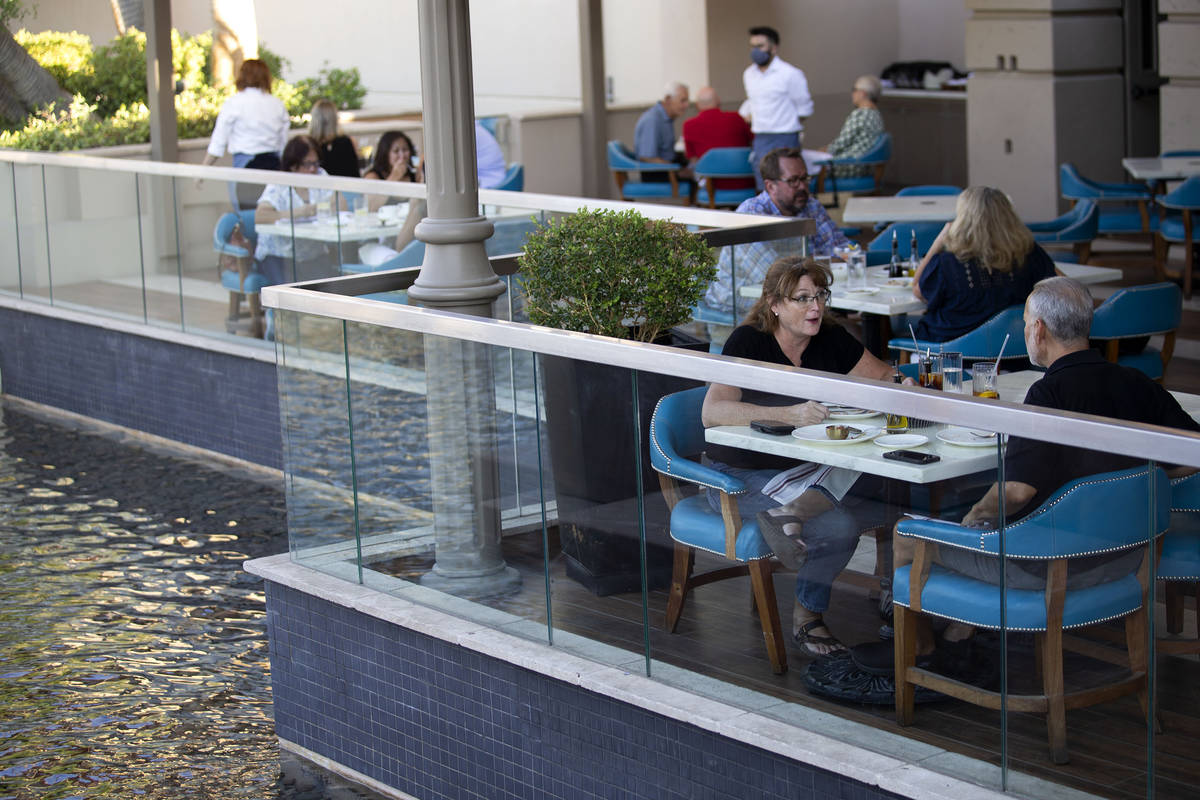 Colleen Diliberto speaks to her husband Michael Diliberto while eating dinner on the patio at O ...