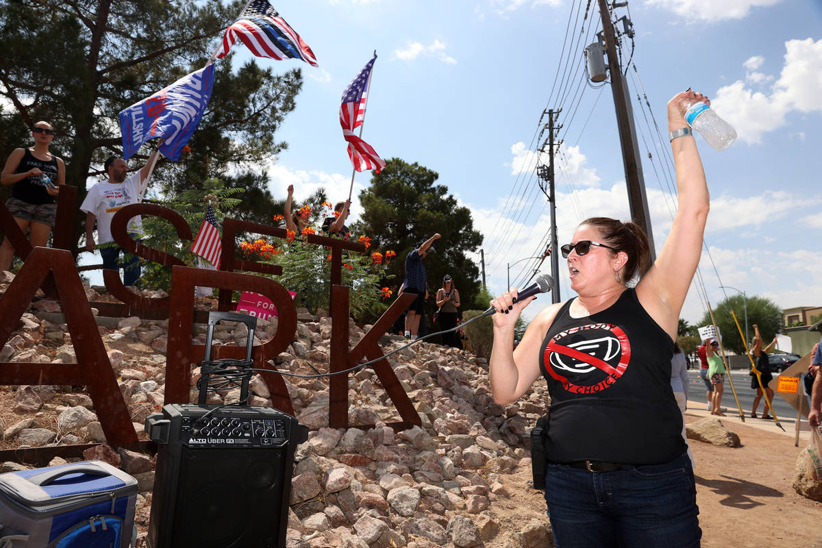 Melissa Blundo, organizer for No Mask Nevada PAC, speaks during a No Mask Nevada PAC rally at S ...