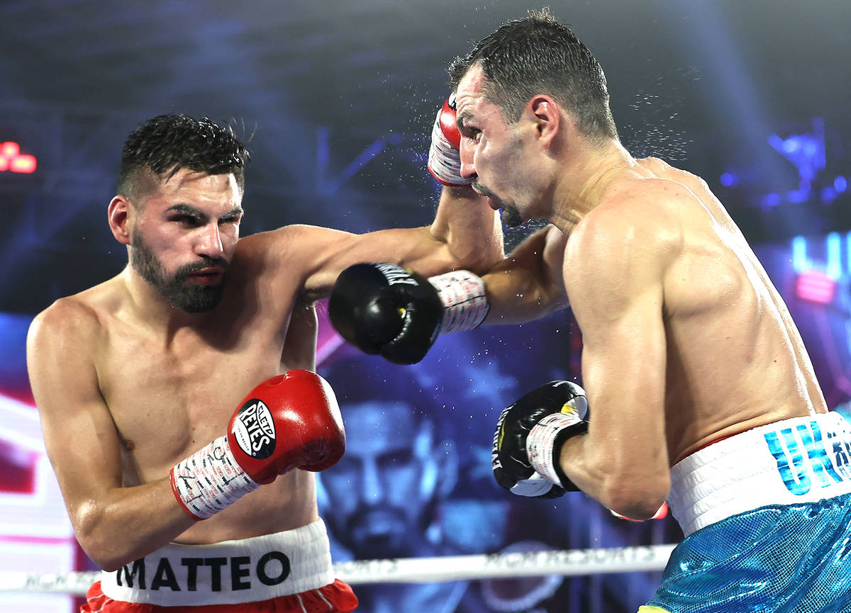 Jose Ramirez connects on a punch to Viktor Postol on Saturday night during their WBC and WBO we ...