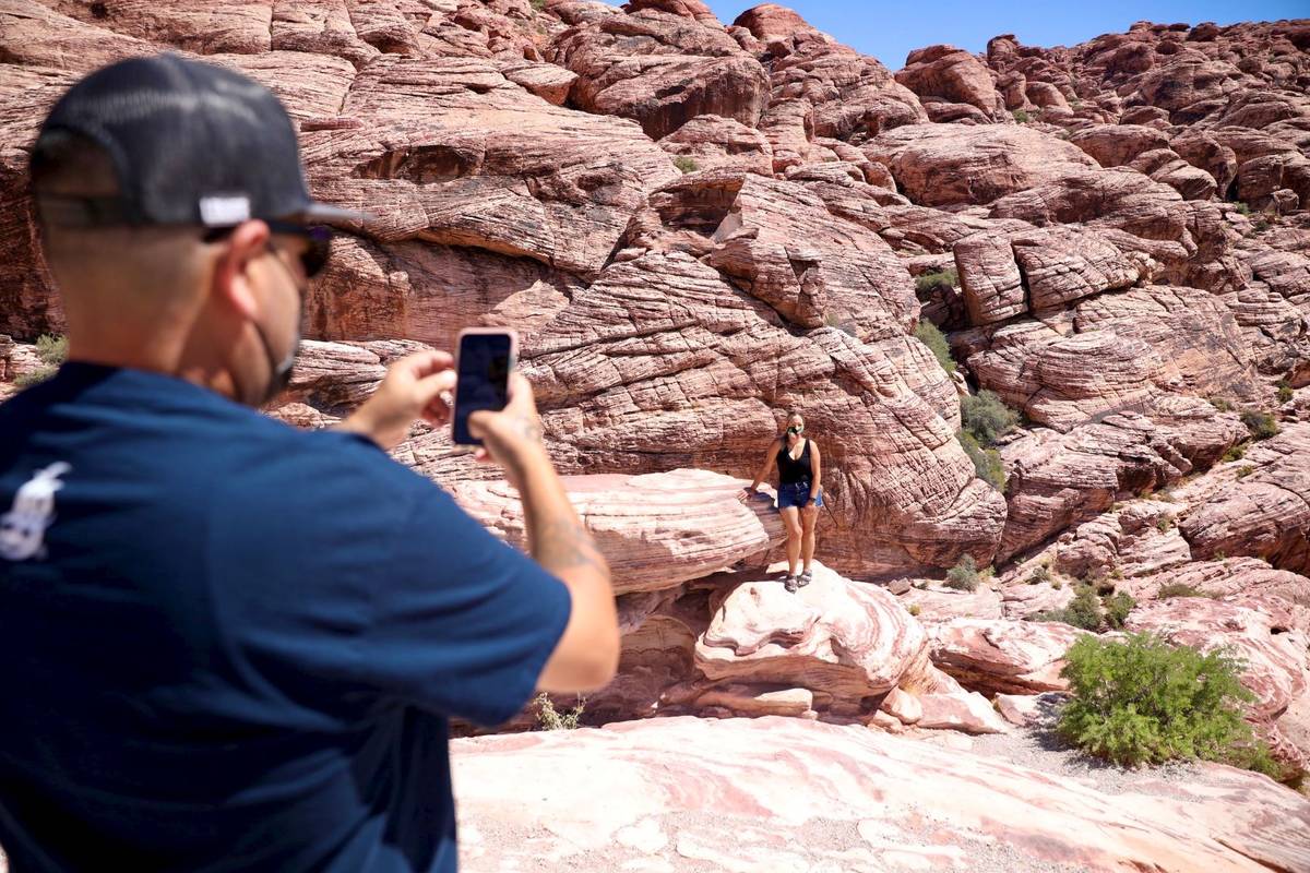 Sergio Perez, left, takes a photo of Karina Moreno, both of Long Beach, at Red Rock National Co ...