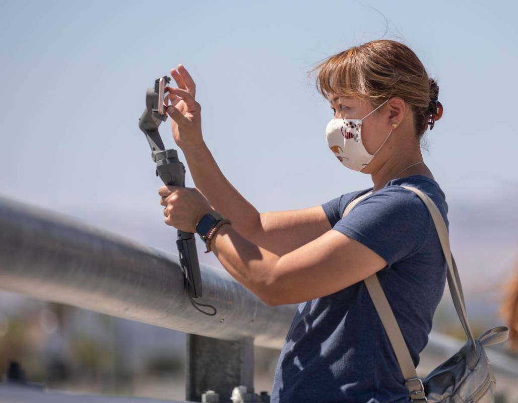 Kyoko Platerio of Las Vegas watches the U.S. Air Force Thunderbirds fly over the Allegiant Stad ...