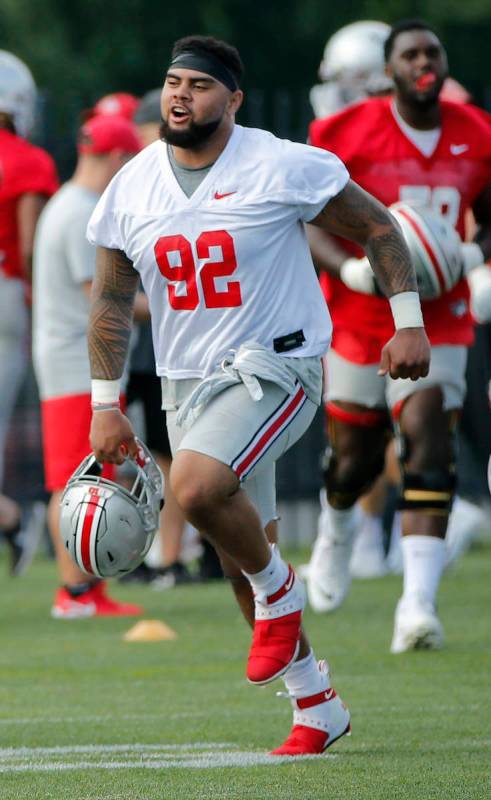 Ohio State Buckeyes defensive tackle defensive tackle Haskell Garrett runs across the field dur ...
