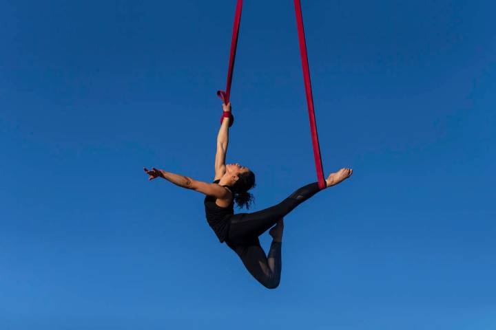 Elema Sanders practices on aerial straps attached to an out-of-service fire truck at the home o ...