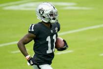 Las Vegas Raiders wide receiver Henry Ruggs III (11) trains during an NFL football training cam ...