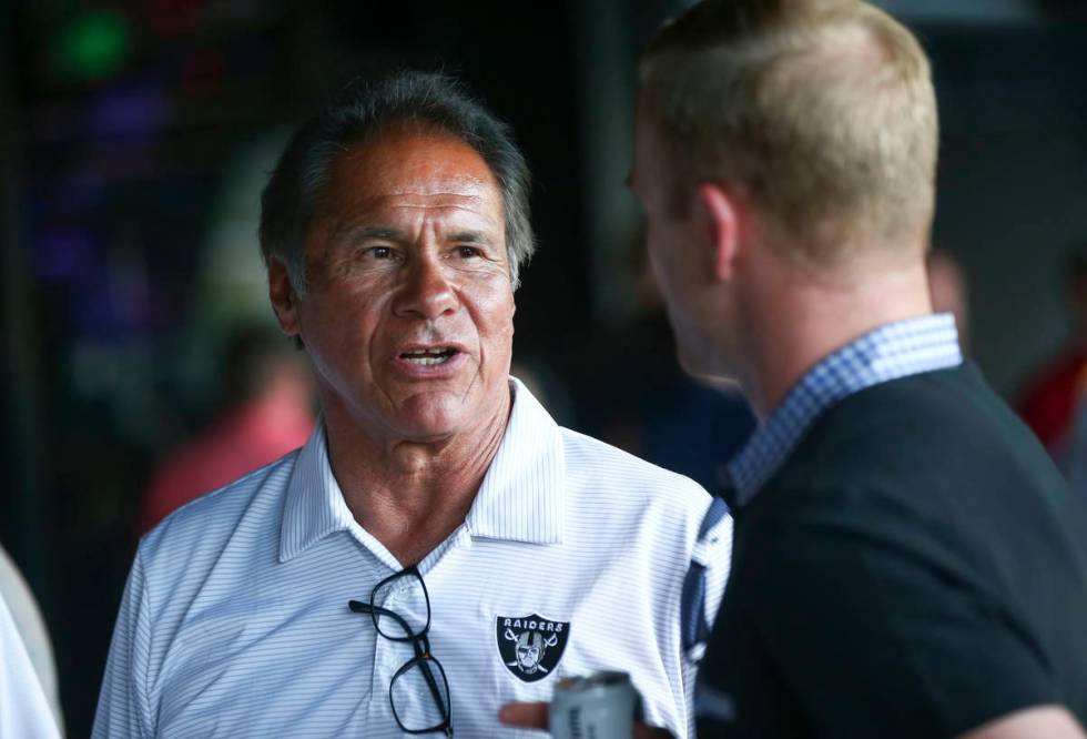 Former Oakland Raiders quarterback Jim Plunkett mingles with attendees during the Raiders Found ...