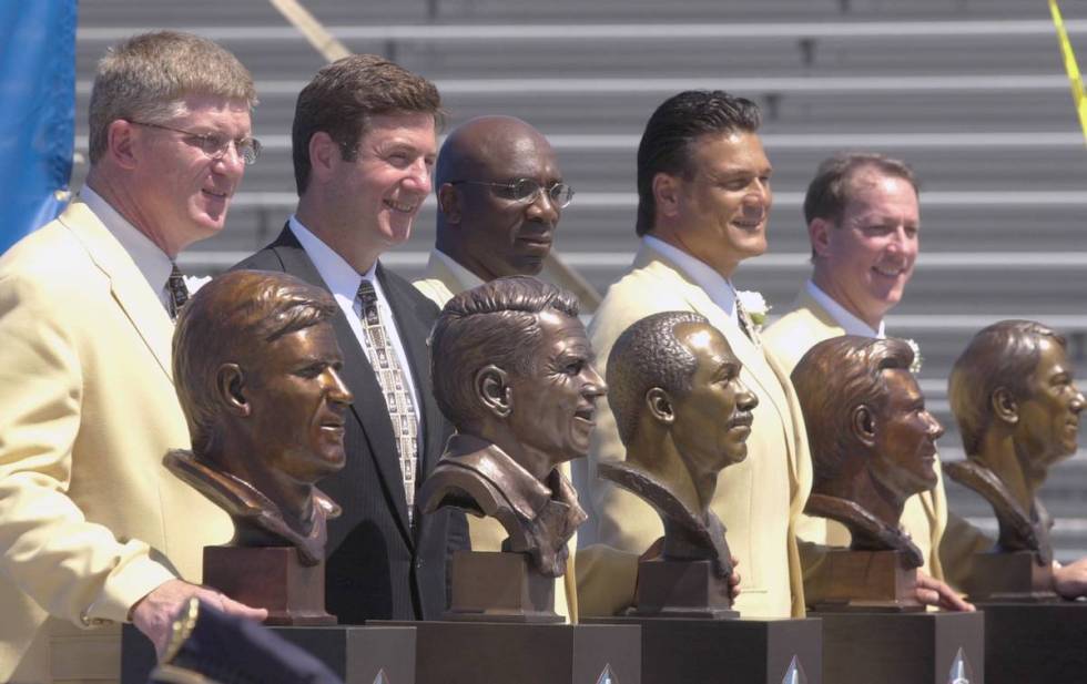 The Class of 2002 pose with their busts after enshrinement into the Pro Football Hall of Fame i ...