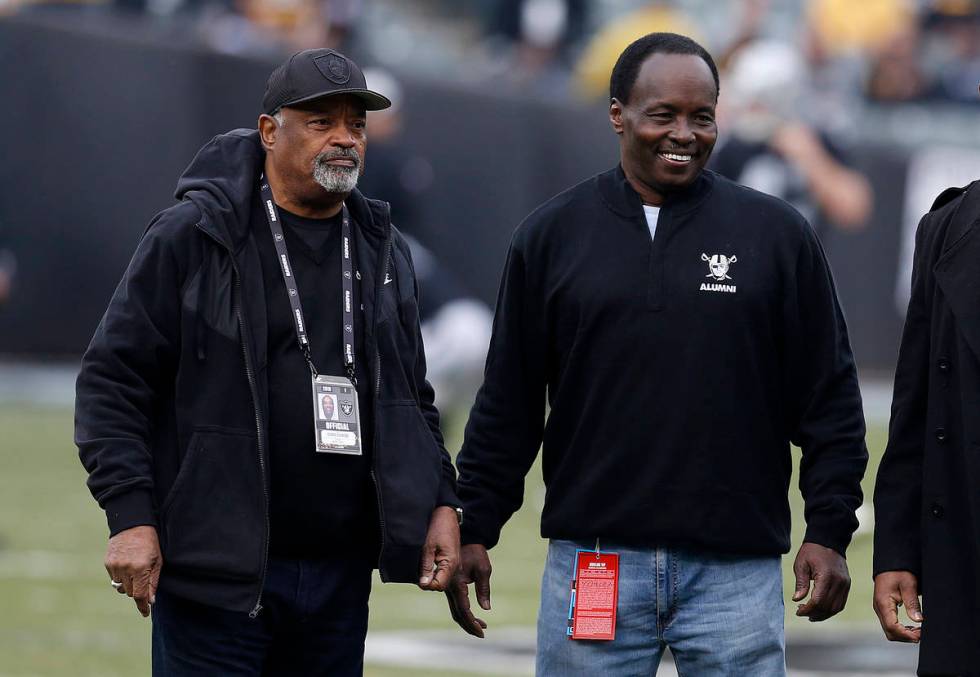 Former Oakland Raiders players George Atkinson, left, and Lester Hayes are shown before an NFL ...