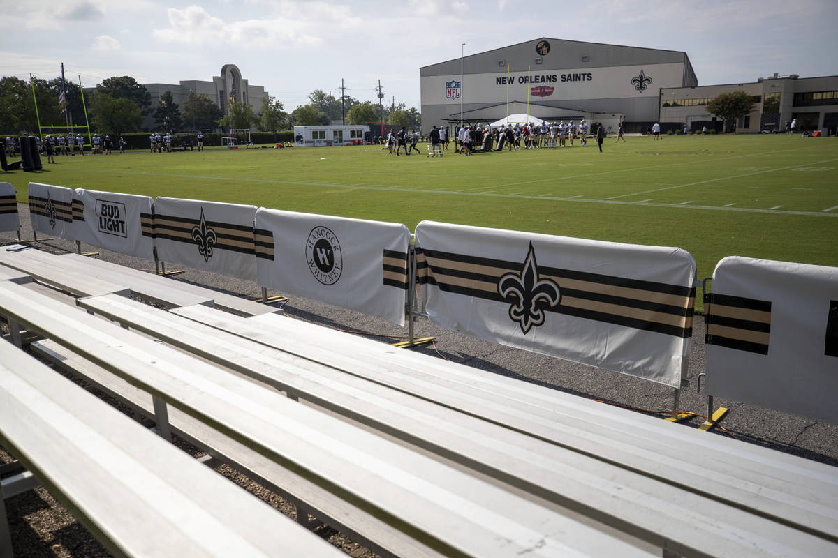 As the New Orleans Saints practice, the bleachers are empty of fans because of the coronavirus ...