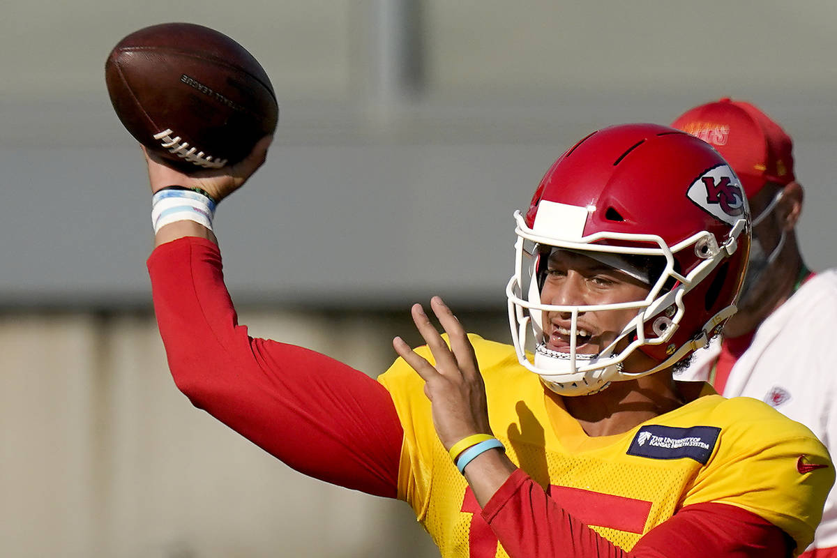 Kansas City Chiefs quarterback Patrick Mahomes passes during an NFL football training camp prac ...