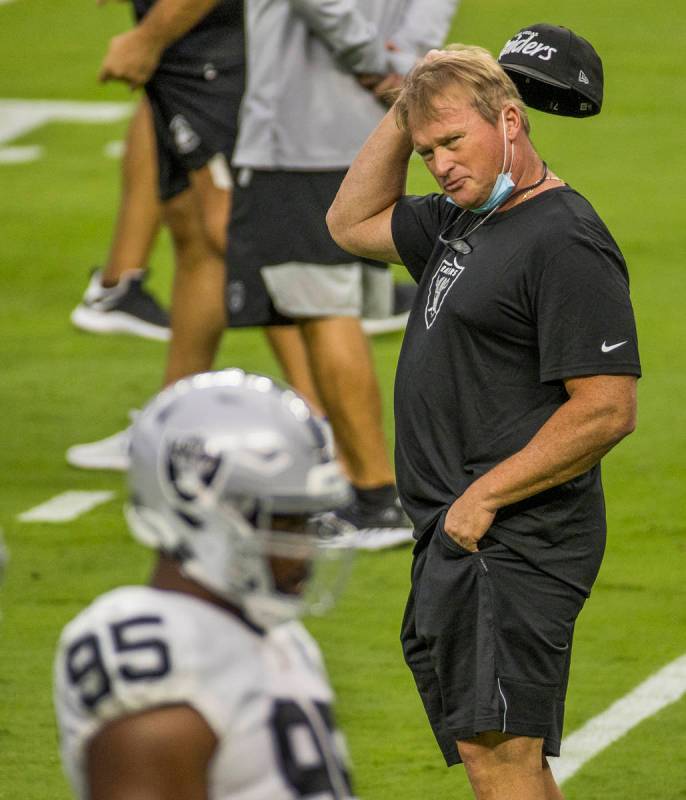 Las Vegas Raiders head coach Jon Gruden scratches his head while looking towards defensive line ...