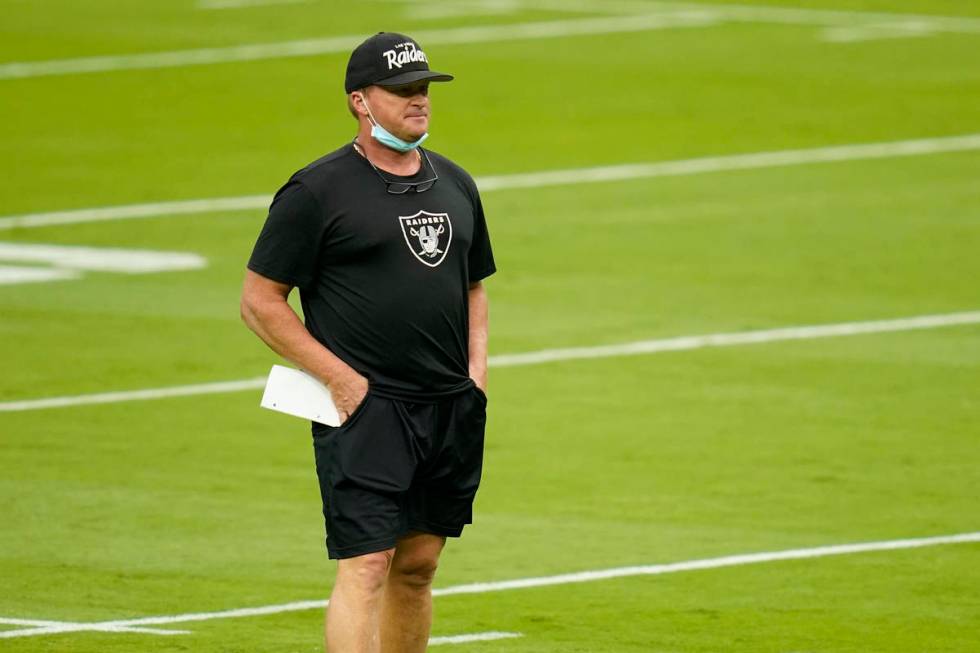 Las Vegas Raiders head coach Jon Gruden watches during an NFL football training camp practice F ...