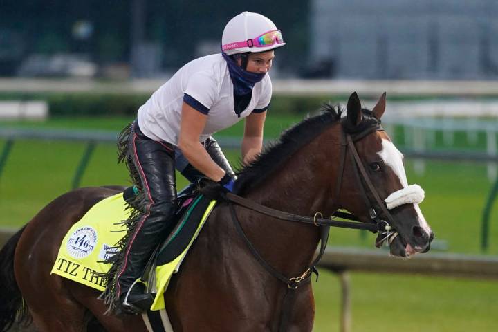 Exercise rider Heather Smullen rides Kentucky Derby entry Tiz the Law during a workout at Churc ...