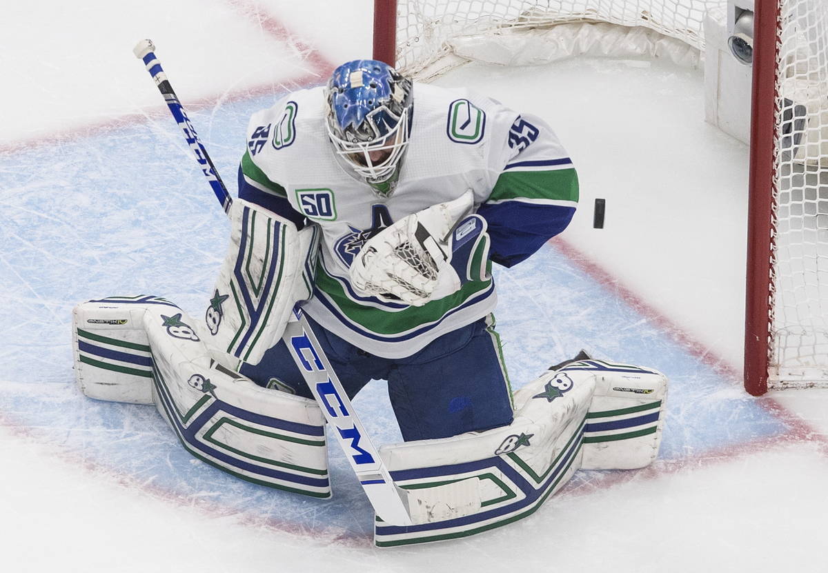 Vancouver Canucks goalie Thatcher Demko makes a save against the Vegas Golden Knights during th ...