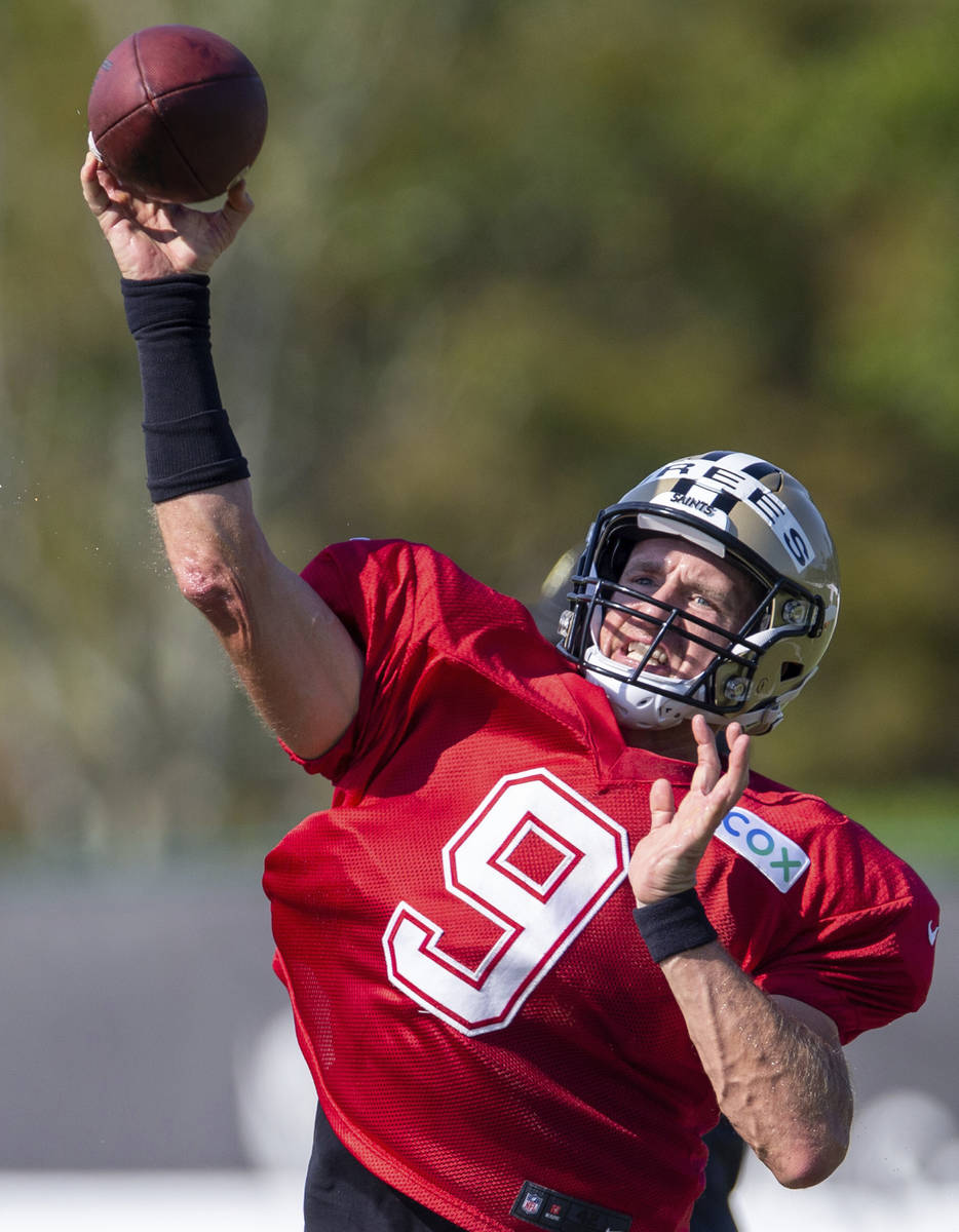 FILE - New Orleans Saints quarterback Drew Brees (9) throws the ball during NFL football traini ...