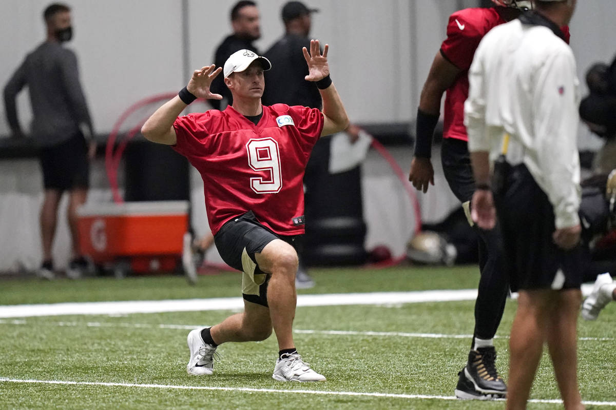 New Orleans Saints quarterback Drew Brees (9) stretches during practice at their NFL football t ...
