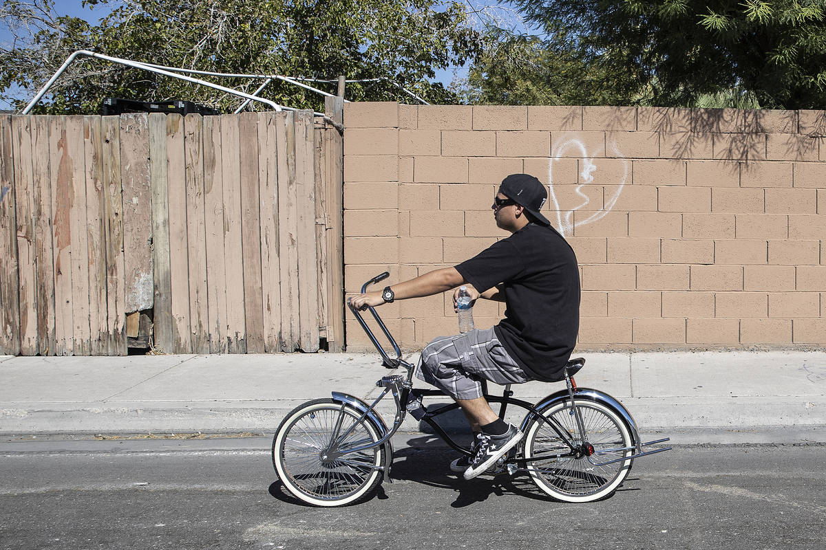 A man rides a bike south on Pecos Road on Wednesday, Sept. 2, 2020, in North Las Vegas. (Benjam ...