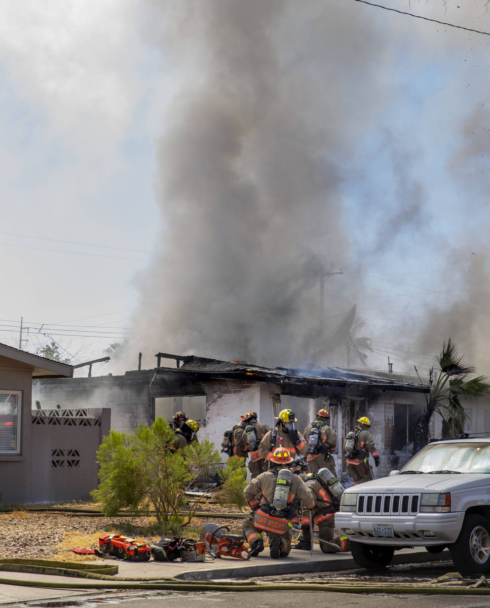 Las Vegas firefighters battle a house fire on 5400 block of West Pebble Beach Boulevard on Wedn ...
