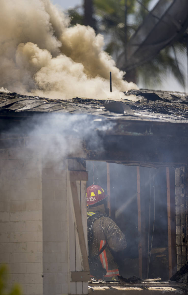 Las Vegas firefighters battle a house fire on 5400 block of West Pebble Beach Boulevard on Wedn ...