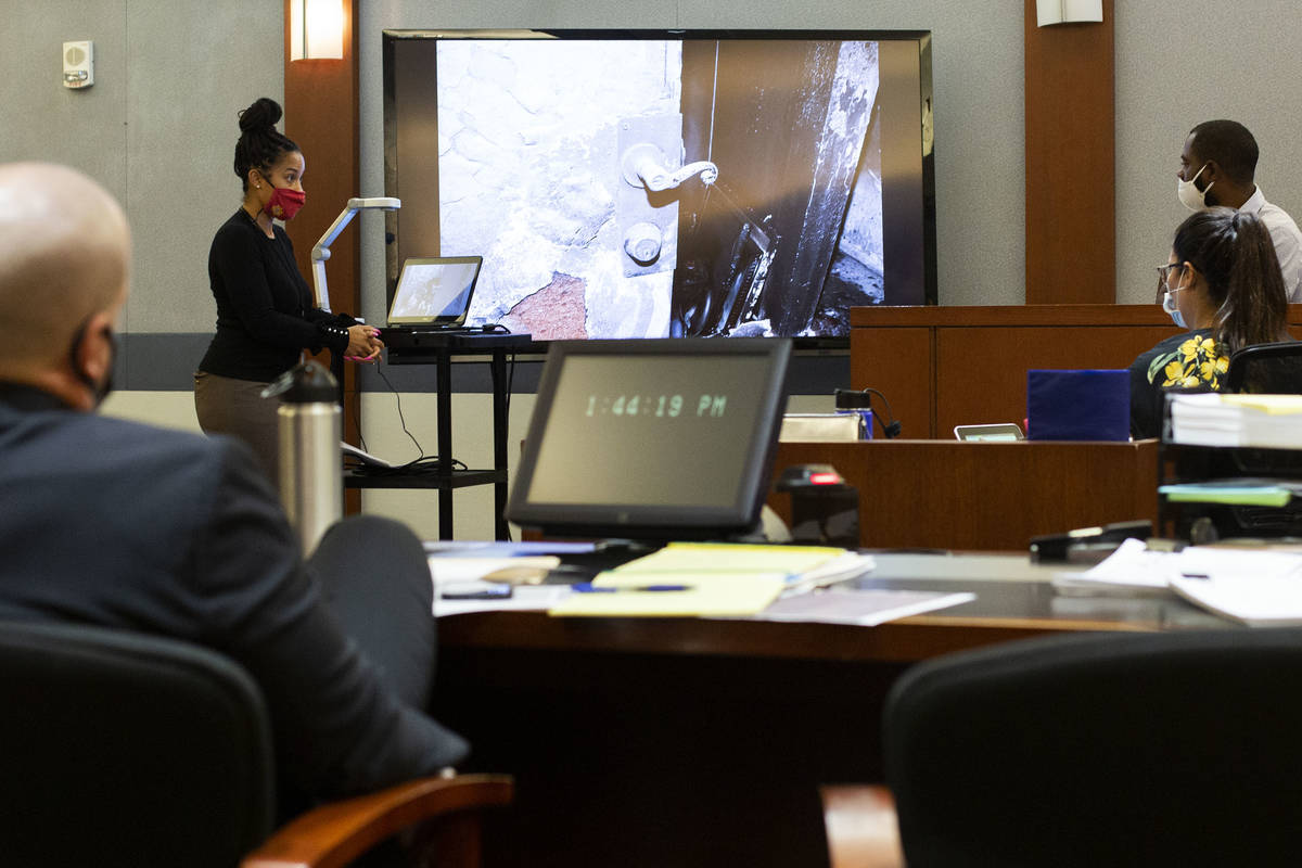 Prosecutor Leah Beverly shows photographs to Corey Evans, a witness in the Alpine fire case, du ...