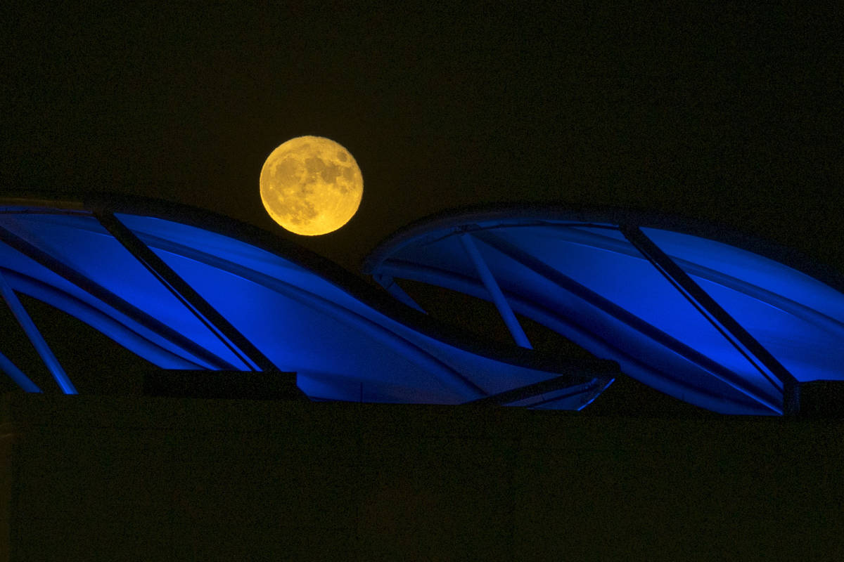 The Corn Moon rises behind Downtown Summerlin on Wednesday, Sept. 2, 2020, in Las Vegas. (L.E. ...