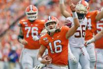 FILE - In this Oct. 12, 2019, filer photo, Clemson quarterback Trevor Lawrence (16) reacts afte ...