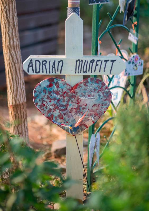 A cross stands as a memorial for Route 91 Harvest festival shooting victim Adrian Murfitt at th ...